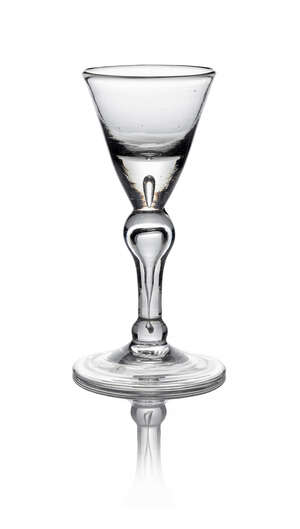 A George I baluster wine glass, c. 1720/30, the trumpet bowl above inverted baluster stem, with basal ball knop, on conical folded foot, 14.1 cm high
		 
		