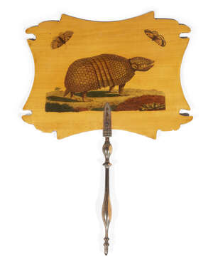 
	
		A decorated sycamore face screen, 19th century, with a printed armadillo, 31cm high

	

