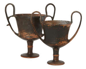 Two Boeotian black glazed kantharoi, circa 5th Century B.C., carinated towards the base, on a stemmed foot with raised ridge, the looped strap handles with int