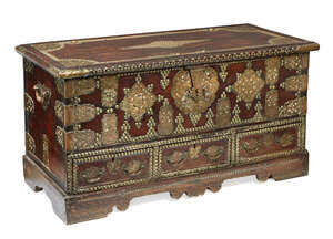 
	
		A hardwood and brass-studded 'Zanzibar' chest, 19th century, the hinged top enclosing a...