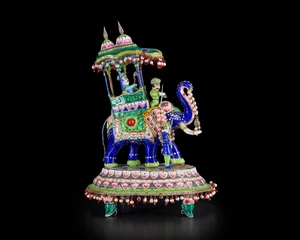 A large figurine of a bedecked elephant in parade,&nbsp;Benares, India, 19th century,&nbsp;
On oval tiered...