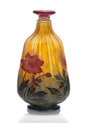 
	
		Daum, a cameo glass bottle with flower form stopper  
		c.1902, engraved Daum Nancy with...