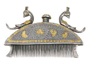 
	
		A gilt-decorated silver hair comb, Kutch, India, mid-19th century, the hemispherical body...