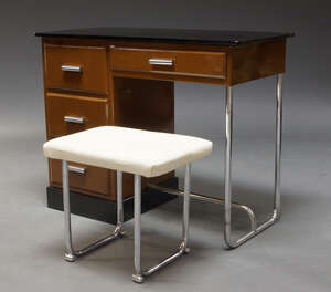
	
		A brown enamelled and tubular steel desk, second half 20th Century, the top surmount with...