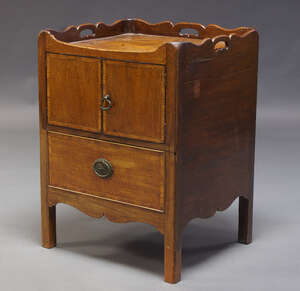 
	
		A George III mahogany and inlaid commode cupboard, the shaped gallery with pierced...