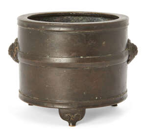 
	
		A Chinese bronze tripod lian-form incense burner, 17th/18th century, of cylindrical form...