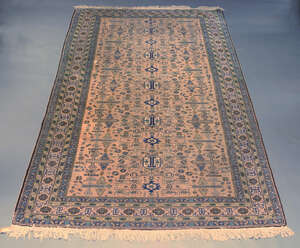 
	
		A woolen rug, Iran, early 20th century, the central reserve decorated with abstract...