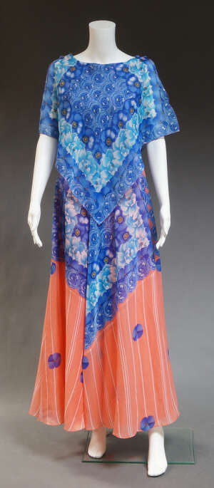 
	
		A John Charles 1970s bold floral full length dress, with handkerchief draping to...