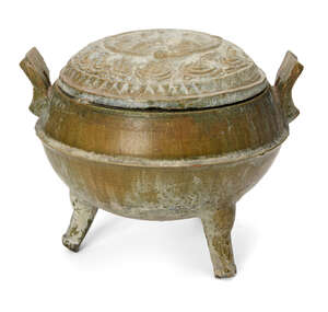 
	
		A Chinese pottery green-glazed ritual tripod food vessel, ding, Han dynasty, the domed...