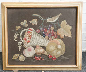 
	
		A Victorian felt-work picture, circa 1860, featuring a bird, a basket of strawberries and...