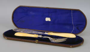 
	
		A cased pair of Victorian silver and ivory fish servers, Sheffield c.1877, Harrison...