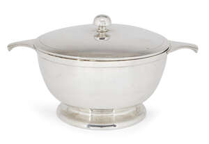 A silver soup tureen, Sheffield, c.1934, Viner's Ltd., of plain, circular form with twin handles and raised on a round foot, the lid with rounded finial an