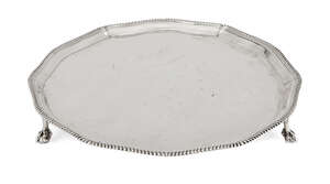 A shaped silver salver with gadroon rim, Sheffield, c.1946, Roberts & Belk, raised on three claw and ball feet, 29cm dia, approx. weight 24.4oz