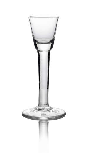 A George II cordial glass, c. 1740, with plain stem, on conical foot, 16.1cm high
		 
		 