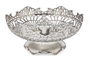 A pierced silver dish, Sheffield, c.1938, Viner's Ltd., of circular form, the foliate pierced body raised on a shaped circular foot, 21.3cm dia., 9cm high,