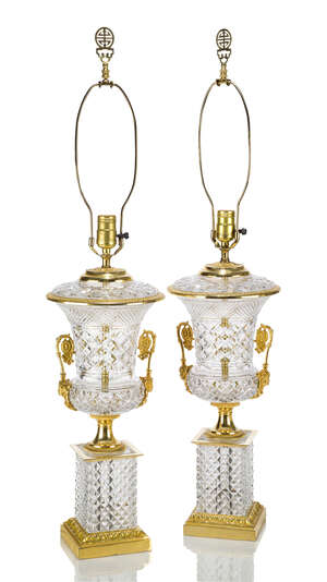 
	
		A pair of Empire style gilt-bronze and glass lamps, late 20th century, the glass bodies...