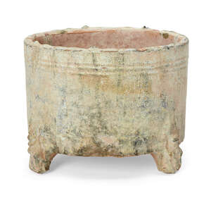 
	
		A Chinese pottery green-glazed cylindrical jar, Han dynasty, with three moulded bear-form...