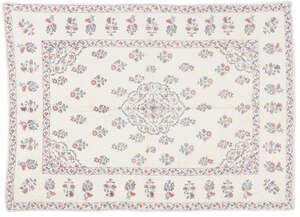 A Mughal embroidered prayer mat, India, 18th century, of rectangular form, the white cotton ground quilted and embroidered in red and green floss silks, the ce