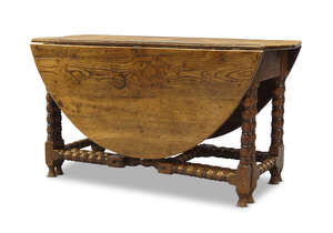 
	
		An oak gate leg table, 18th Century and later,   the oval top with two drop leaves, on...