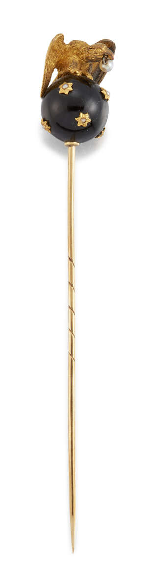 A late 19th century Russian gold, onyx, seed pearl and half-pearl pin, modelled as an eagle...