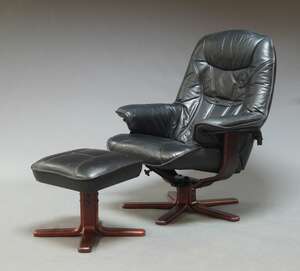 
	
		A modern Danish style leather easy swivel chair and ottoman, 20th Century, with black...