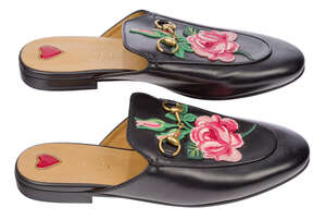 
	
		A pair of Gucci Women's Princetown leather slippers, designed in black leather, with...