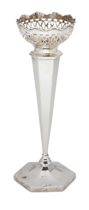 A silver posy vase, Birmingham, c.1913, Jones & Crompton, of tapering faceted form with pierced, shaped rim and hexagonal foot with felt underside, 18.5cm high