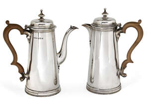 
	
		A pair of silver café-au-lait pots, Birmingham, c.1944, Thomas Ducrow & Sons, of tapering...