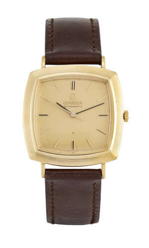 
	
		An 18ct gold automatic wristwatch by Omega, the cushion shaped gilt dial with baton...