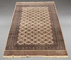 
	
		A Pakistan Bokhara woolen carpet, the central reserve set with stepped lozenge-shaped...