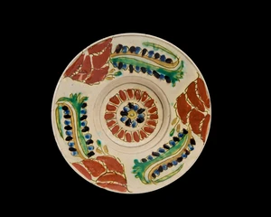 A Kutahya ware pottery shallow dish,&nbsp;Ottoman Turkey, 18th century,&nbsp;
The green, yellow, blue,...
