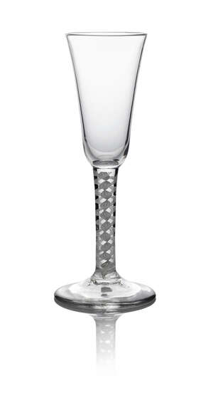 A George II flute, c. 1750, the fluted bowl above double series opaque twist stem,  on circular foot, 18.7cm high
		 
		 
		 