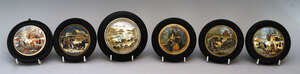 A Pratt ware pot lid entitled Sebastopol, 8.9cm diameter, in a wooden frame, together with five other smaller potlids, one entitled Alas Poor Bruin, two entitl