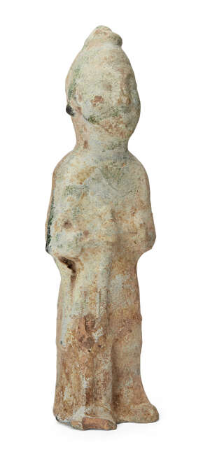 
	
		A Chinese pottery tomb figure, Han dynasty, modelled standing holding a rifle in front of...