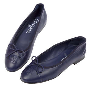 
	
		A pair of Chanel lambskin ballet flats, designed in blue with characteristic 'CC' logo to...