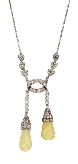 
	
		A Belle Epoque platinum, opal and diamond lavaliere necklace, designed as two pear shaped...