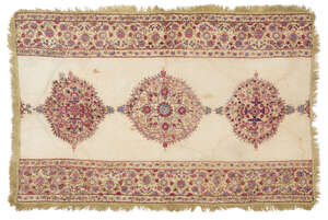 A Mughal embroidered Kashidakari cotton prayer mat, India, 18th century, of rectangular form, the cream cotton ground with three central floriated medallions d