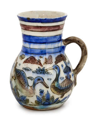 
	
		A small Qajar jug with birds, Iran, 19th century, of globular form, with curved handle,...
