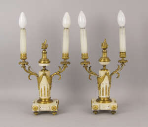 
	
		A pair of white marble and gilt bronze two light candelabra, 19th century, with central...