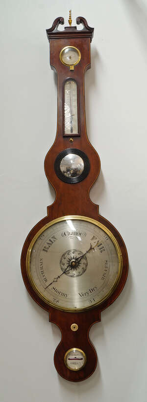 
	
		A George III mahogany and line strung wheel barometer, with swan neck pediment, above...