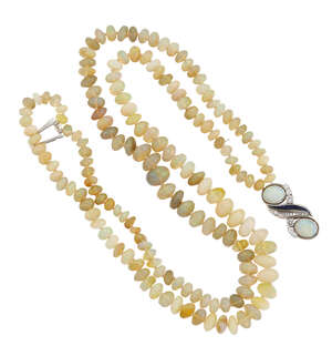 
	
		An opal, sapphire and diamond necklace, composed of two rows of bouton shaped opal beads...