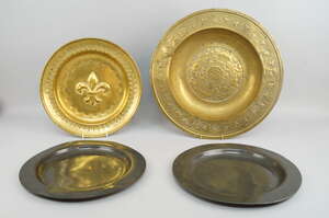 
	
		A brass circular alms dish, probably Nuremburg, late 17th/early 18th century, with...