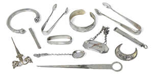 
	
		A group of small silver items including: a George IV Scottish silver paperknife,...