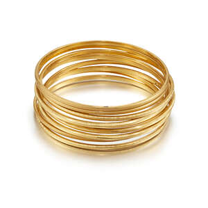 A group of  nine bangles, each with milled dec
		cration, all inner diameter 5.8cm (9)