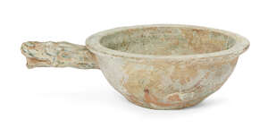 
	
		A Chinese pottery grain scoop, Han dynasty, covered in a green glaze, with everted rim...