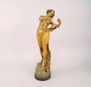 
	
		A Goldscheider terracotta model of a nude woman, clothed in drapery, on a natural rocky...