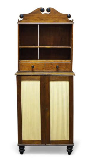 
	
		A George IV and later mahogany bookcase cabinet, the top section with raised shaped back,...