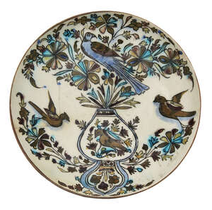 
	
		A Qajar dish with flowers and birds, Iran, 19th century, underglaze painted in cobalt,...