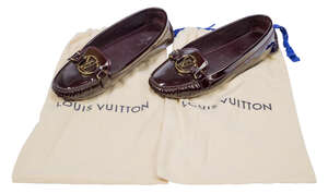 
	
		A pair of Louis Vuitton patent Oxford loafers, each designed in patent burgundy, with...