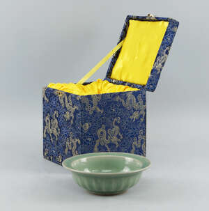 
	
		A Chinese celadon porcelain bowl, in the Ming style, of recent manufacture, with a thick...